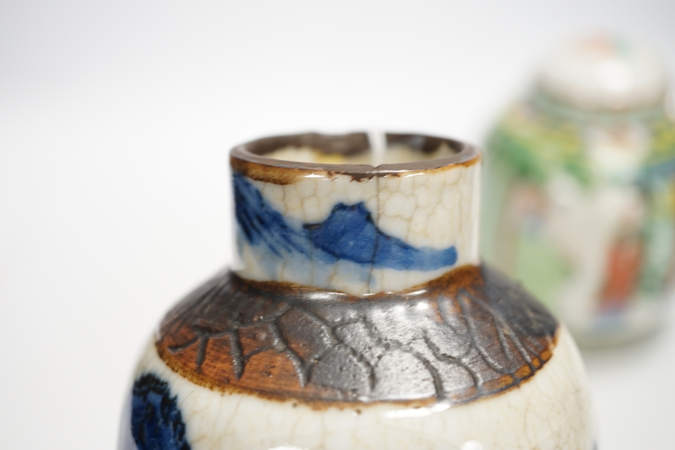 Chinese ceramics to include a crackleware vase and a blue and white vase, a jar and cover and a rice bowl, tallest 20cm high. Condition - all items damaged, overall poor